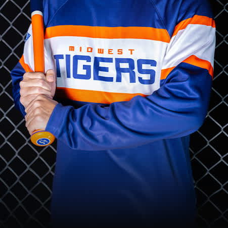 a baseball player wearing a blue and orange pullover