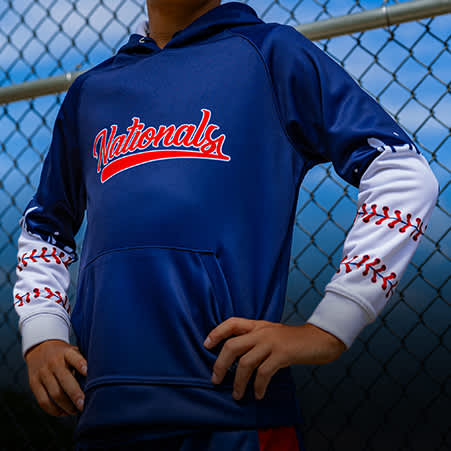 a baseball player wearing a blue and red pullover