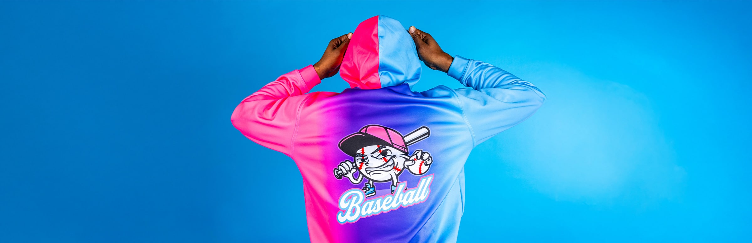 Man in a Pink and Blue Hoodie with Baseball graphics