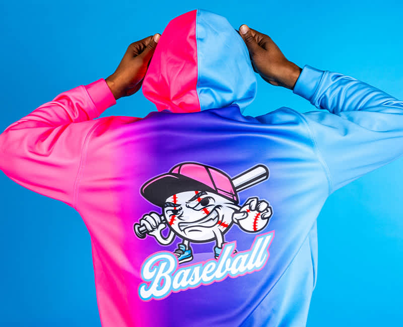 Man in a Pink and Blue Hoodie with Baseball graphics