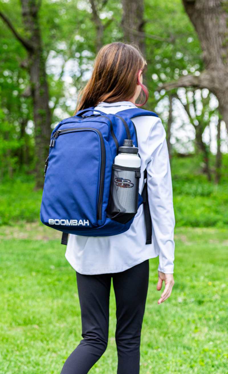Adalynn wearing the Cohort Backpack