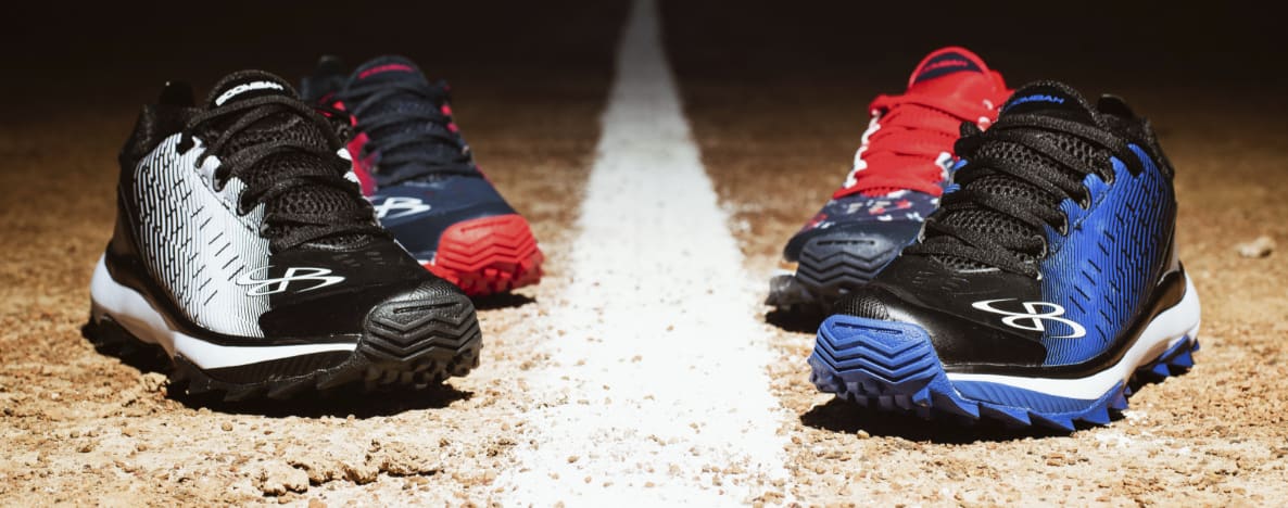 Four sports shoes on a baseball diamond