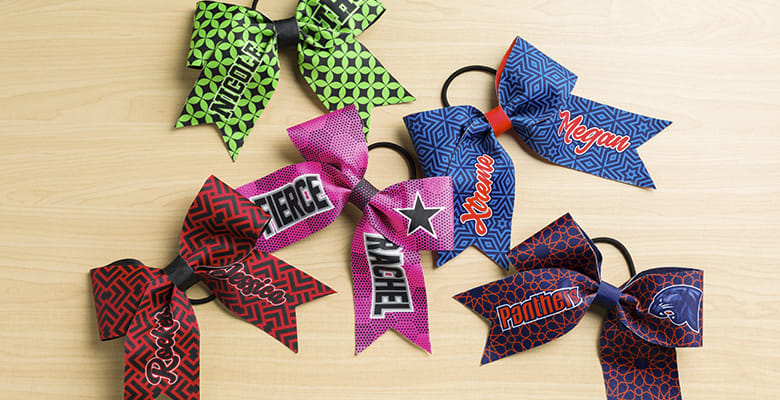 Custom Bows laid out on wood table